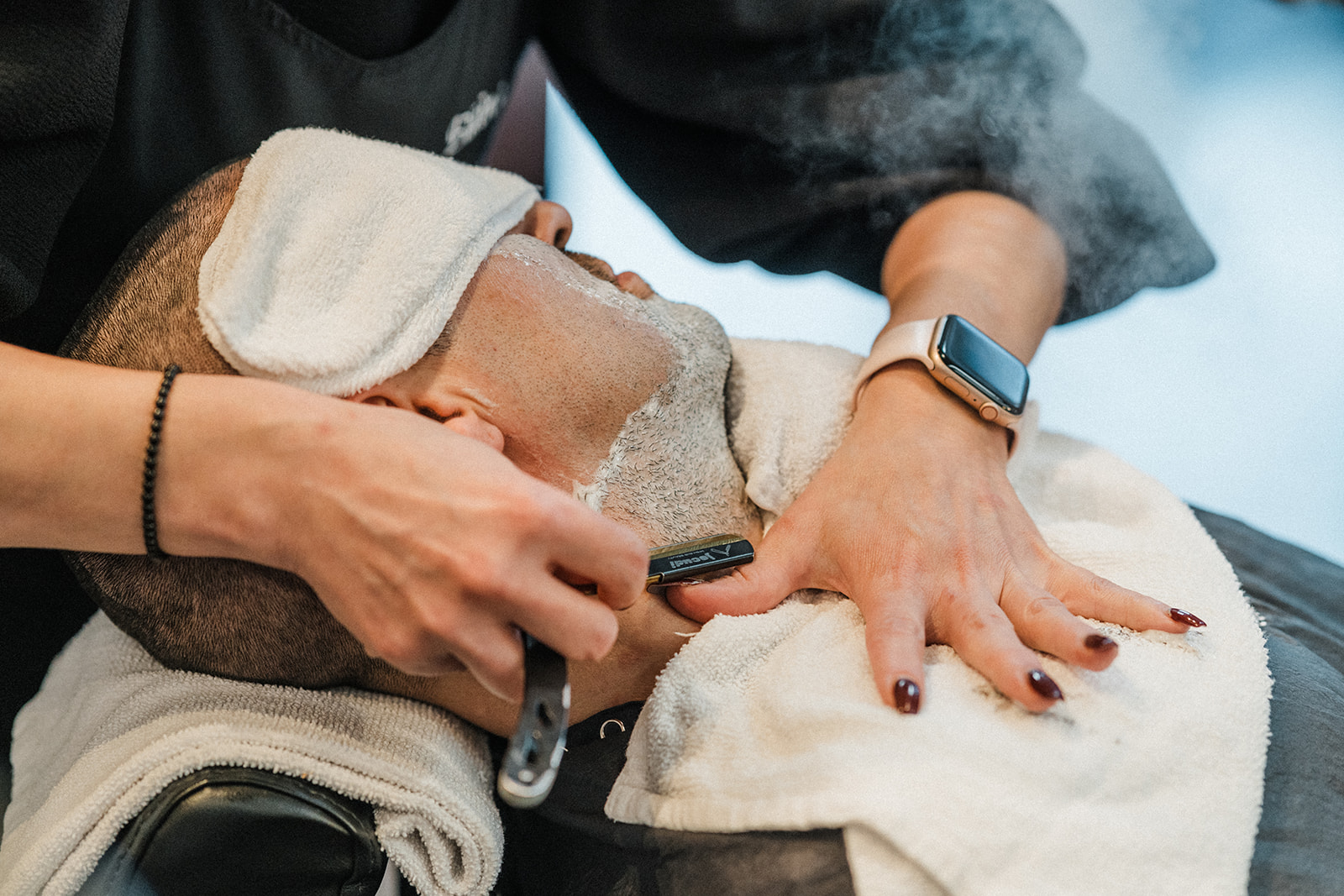 Hot-towel straight-razor shave in progress