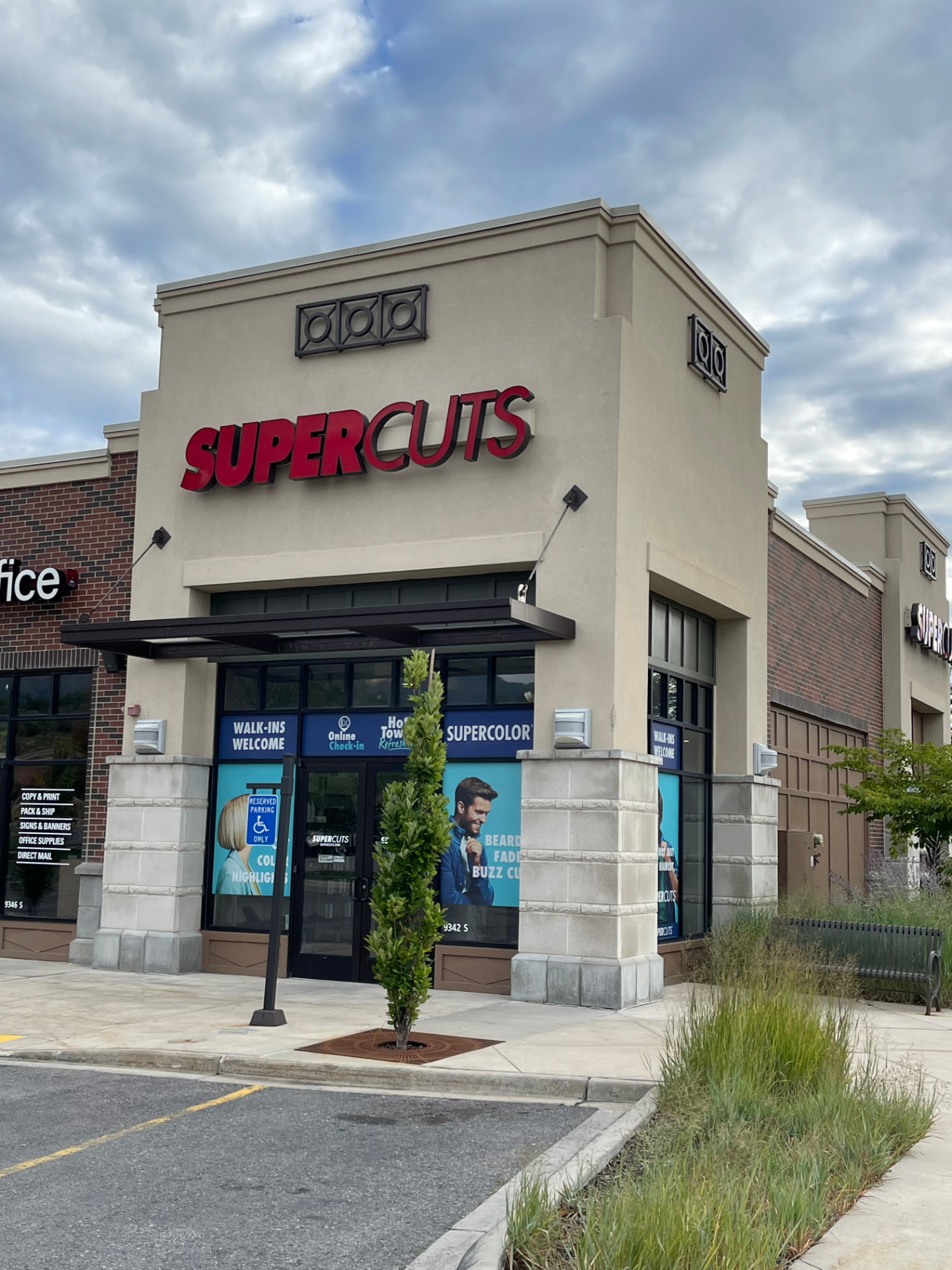 Supercuts storefront with walk-ins welcome signage